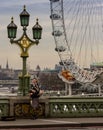 London, United Kingdom - Monday, Ã¢â¬Å½February Ã¢â¬Å½6, Ã¢â¬Å½2017. A bagpiper plays for tips on London`s Westminster bridge.
